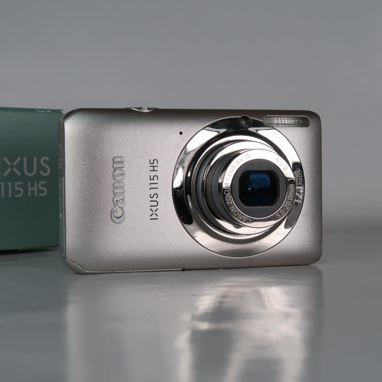 Canon IXUS 115 HS PowerShot ELPH 100 HS 12.1MP 4x Digital Camera Silver – Very Good Condition
