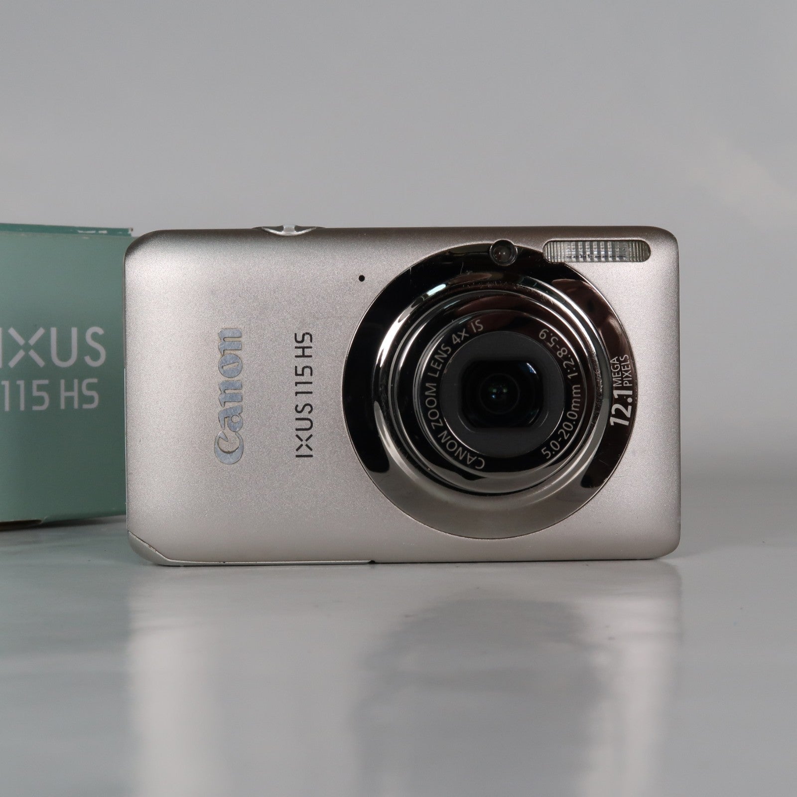 Canon IXUS 115 HS PowerShot ELPH 100 HS 12.1MP 4x Digital Camera Silver – Very Good Condition